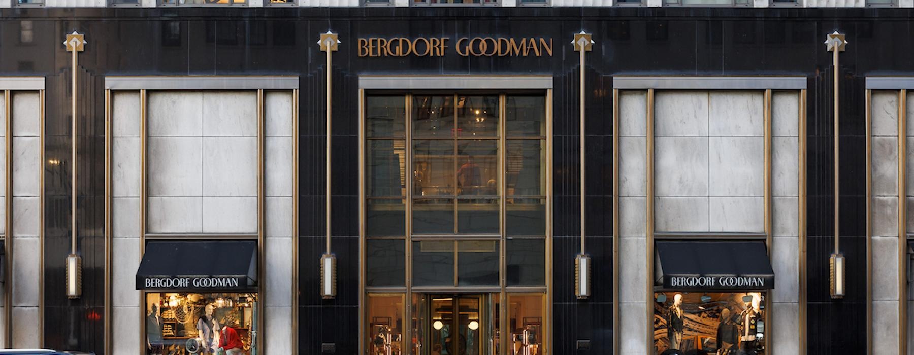 a building with windows and a car parked in front