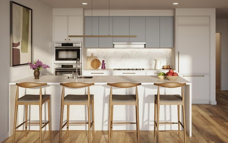 a kitchen with a table and chairs