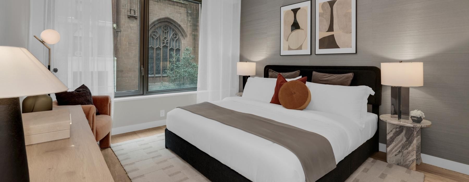 a bedroom with a large window