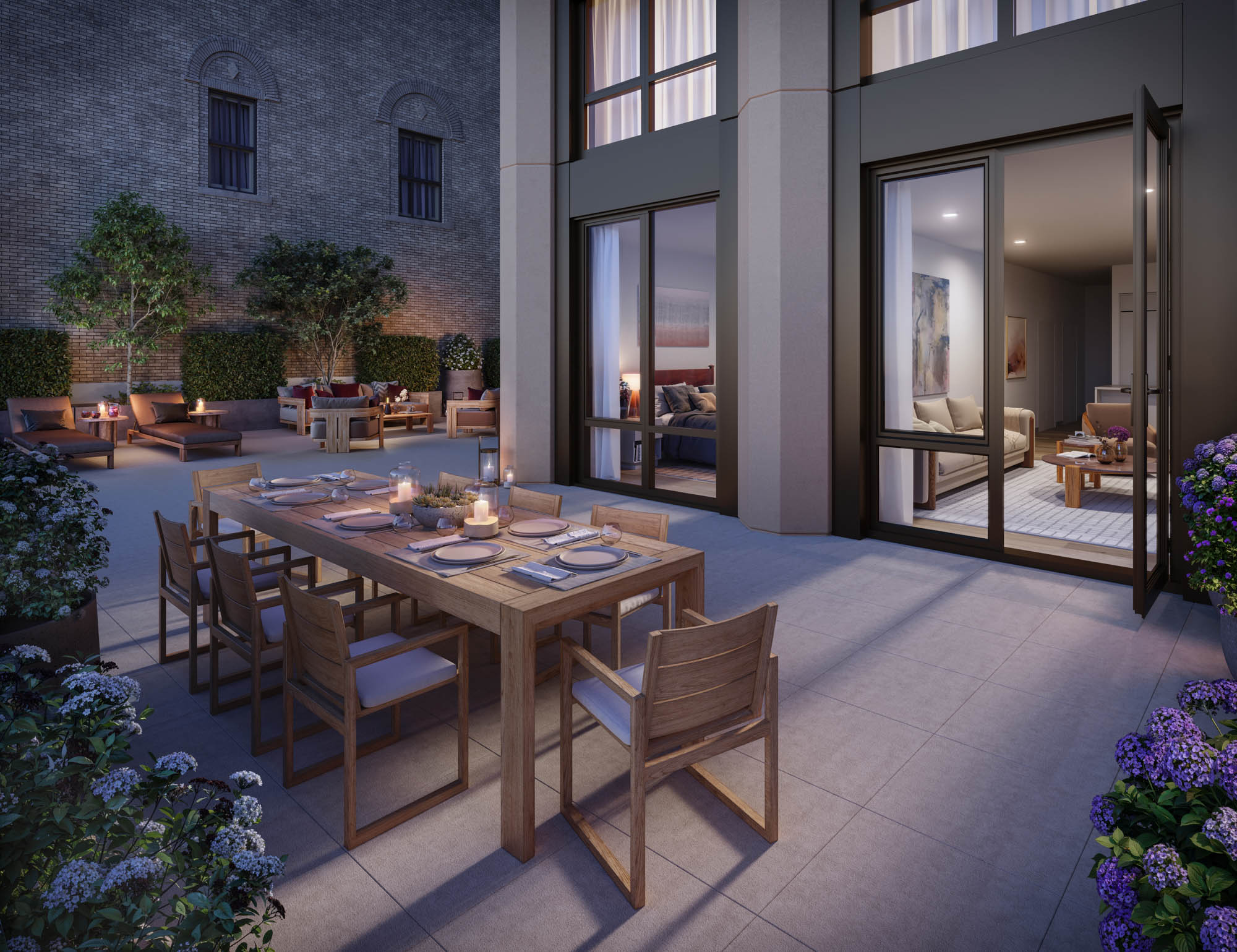 dining table at dusk on a Manhattan apartment terrace with lounge chairs in the background